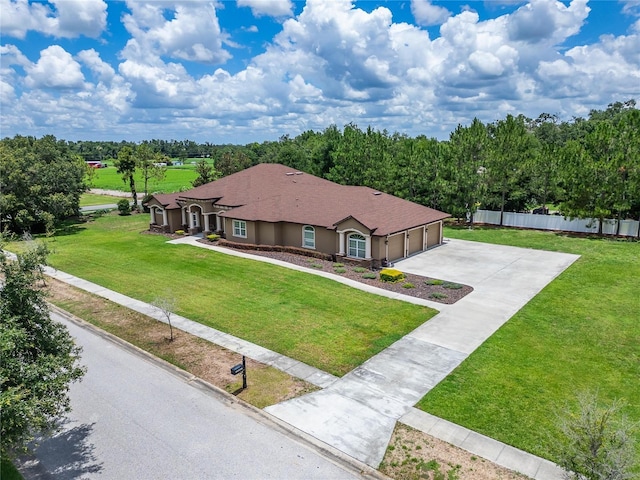 13102 Done Groven Dr, Dover, FL 33527 - view of front of house with concrete driveway and an attached garage