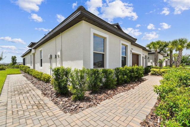 10282 Echo Dock Loop, San Antonio, FL 33576 - view of side of property featuring stucco siding