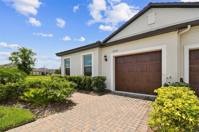 10282 Echo Dock Loop, San Antonio, FL 33576 - view of front of house with stucco siding
