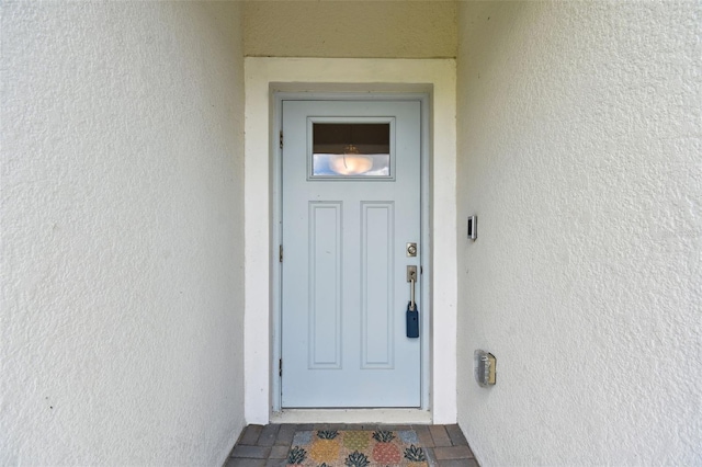 10282 Echo Dock Loop, San Antonio, FL 33576 - entrance to property featuring stucco siding