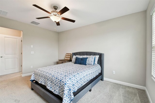 10282 Echo Dock Loop, San Antonio, FL 33576 - carpeted bedroom featuring baseboards and a ceiling fan