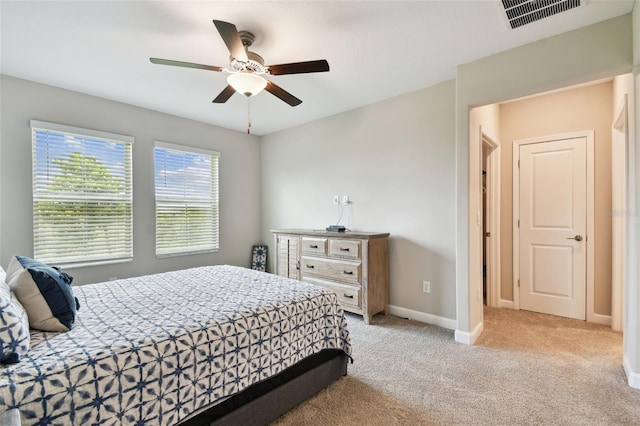 10282 Echo Dock Loop, San Antonio, FL 33576 - carpeted bedroom with baseboards and ceiling fan