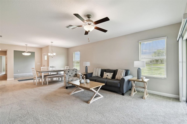 10282 Echo Dock Loop, San Antonio, FL 33576 - living area featuring light colored carpet, a ceiling fan, and a chandelier