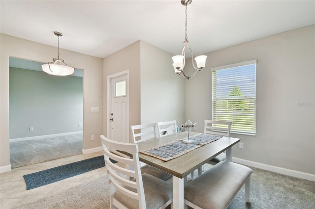 10282 Echo Dock Loop, San Antonio, FL 33576 - dining area featuring healthy amount of natural light, a chandelier, and carpet floors