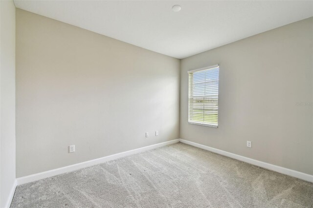 10282 Echo Dock Loop, San Antonio, FL 33576 - carpeted spare room featuring baseboards
