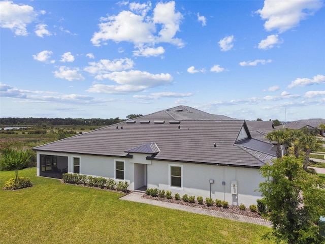10282 Echo Dock Loop, San Antonio, FL 33576 - back of property featuring stucco siding and a lawn