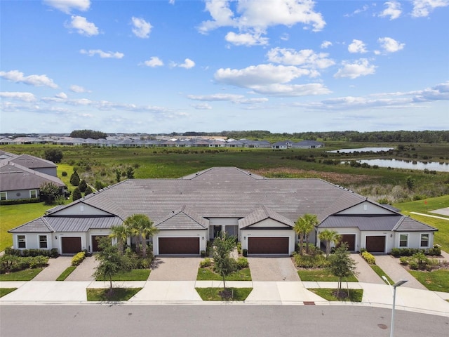 10282 Echo Dock Loop, San Antonio, FL 33576 - view of front of home featuring a water view and driveway