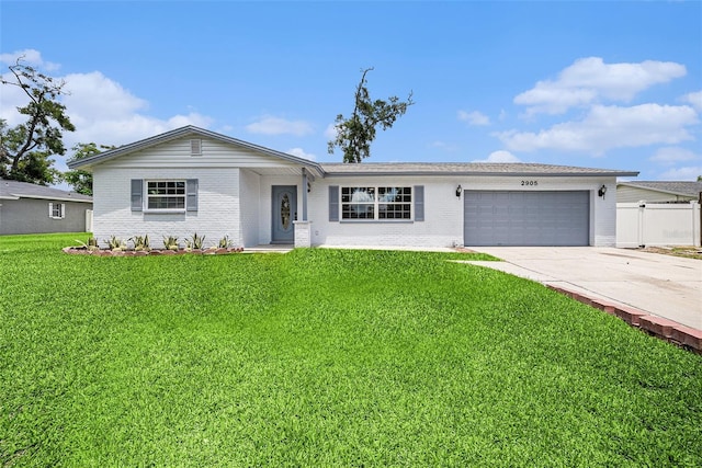2905 Forest Cir, Seffner, FL 33584 - ranch-style house featuring brick siding, a garage, and driveway