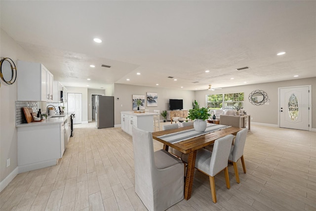 2905 Forest Cir, Seffner, FL 33584 - dining space with recessed lighting, light wood-style flooring, and a ceiling fan
