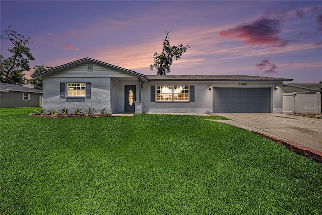 2905 Forest Cir, Seffner, FL 33584 - single story home with brick siding, an attached garage, and driveway
