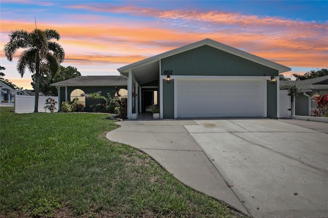 852 Crystal Dr, Palm Harbor, FL 34683 - view of front of house with an attached garage and driveway