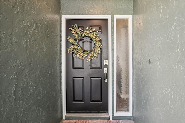 852 Crystal Dr, Palm Harbor, FL 34683 - property entrance with stucco siding