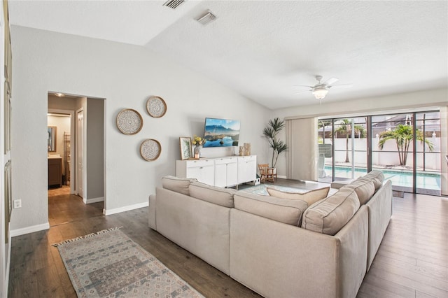 852 Crystal Dr, Palm Harbor, FL 34683 - living area with lofted ceiling, a ceiling fan, and wood finished floors