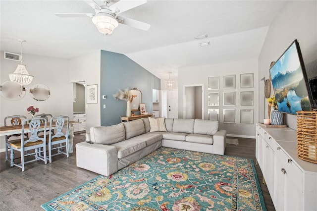 852 Crystal Dr, Palm Harbor, FL 34683 - living room featuring ceiling fan, wood finished floors, lofted ceiling, and a chandelier