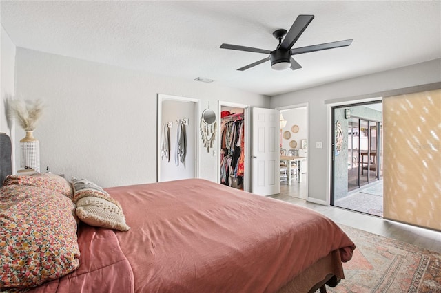 852 Crystal Dr, Palm Harbor, FL 34683 - bedroom featuring a walk in closet, ceiling fan, a closet, and wood finished floors
