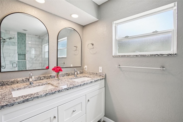 852 Crystal Dr, Palm Harbor, FL 34683 - full bathroom with plenty of natural light, double vanity, and tiled shower