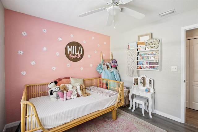 852 Crystal Dr, Palm Harbor, FL 34683 - bedroom with wood finished floors and ceiling fan