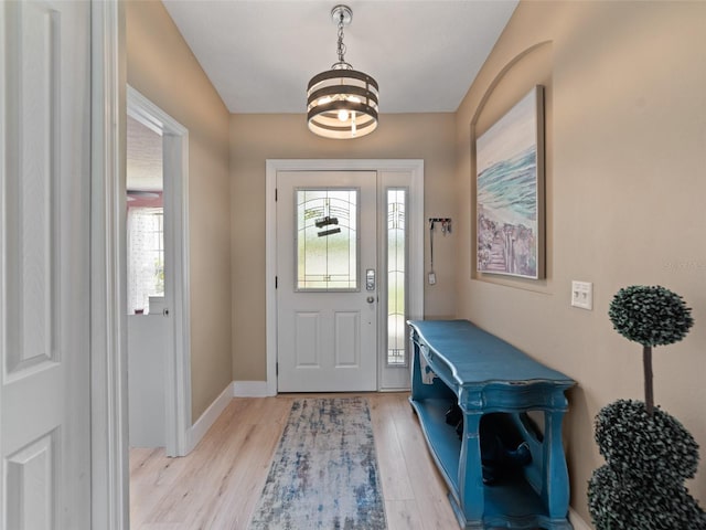 9702 Mary Robin Dr, Riverview, FL 33569 - entryway featuring light wood finished floors and a chandelier