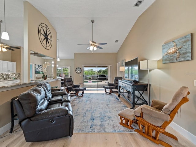 9702 Mary Robin Dr, Riverview, FL 33569 - living room featuring ceiling fan, high vaulted ceiling, and light wood-style floors