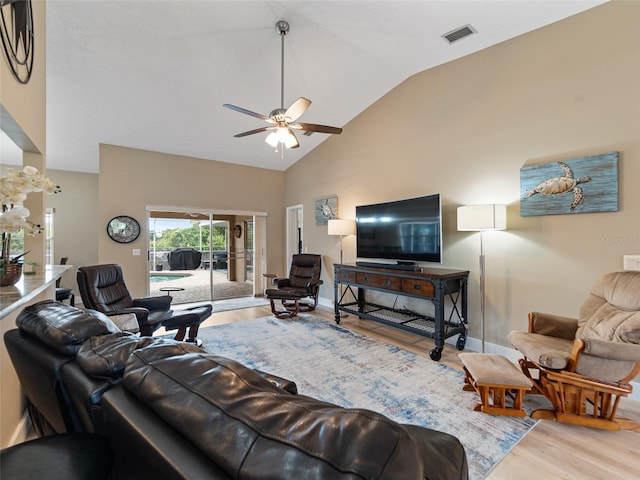 9702 Mary Robin Dr, Riverview, FL 33569 - living area with light wood-type flooring, a ceiling fan, and high vaulted ceiling