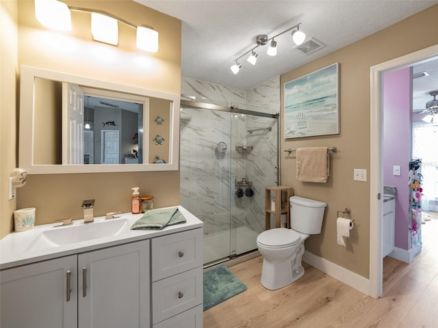 9702 Mary Robin Dr, Riverview, FL 33569 - bathroom with wood finished floors, vanity, and a marble finish shower