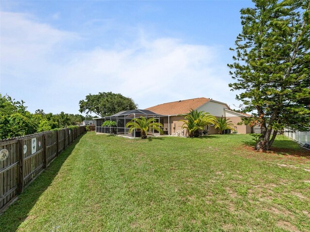 9702 Mary Robin Dr, Riverview, FL 33569 - fenced backyard with glass enclosure
