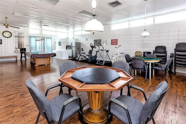 8584 111th St Unit 308, Seminole, FL 33772 - dining space with pool table, dark wood finished floors, and a paneled ceiling