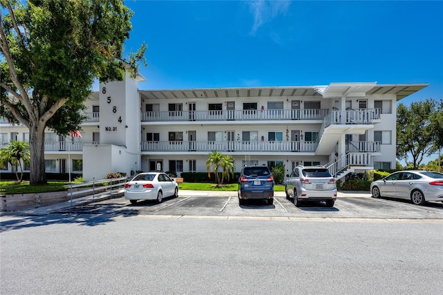 8584 111th St Unit 308, Seminole, FL 33772 - view of property featuring uncovered parking