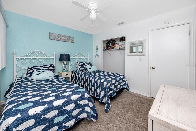 8584 111th St Unit 308, Seminole, FL 33772 - bedroom featuring carpet, a closet, and a ceiling fan