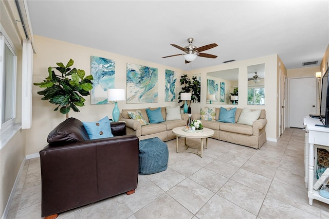 8584 111th St Unit 308, Seminole, FL 33772 - living area with a ceiling fan and baseboards