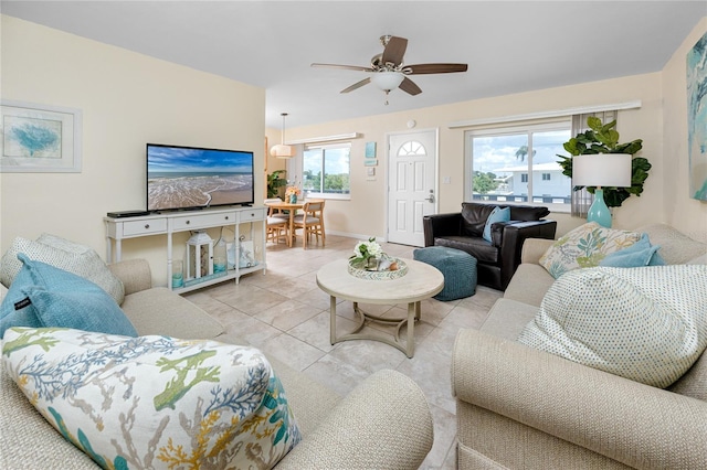 8584 111th St Unit 308, Seminole, FL 33772 - living area with a ceiling fan and light tile patterned flooring