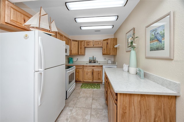8584 111th St Unit 308, Seminole, FL 33772 - kitchen featuring white appliances, light countertops, and light tile patterned floors