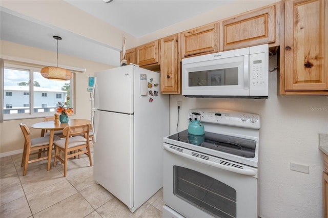 8584 111th St Unit 308, Seminole, FL 33772 - kitchen with white appliances, light tile patterned floors, light brown cabinetry, and pendant lighting