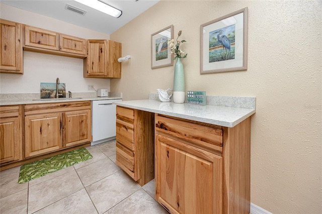 8584 111th St Unit 308, Seminole, FL 33772 - kitchen featuring dishwasher, light countertops, lofted ceiling, and light tile patterned floors