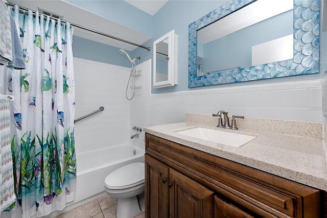 8584 111th St Unit 308, Seminole, FL 33772 - full bath featuring vanity, shower / bath combination with curtain, tile walls, tile patterned flooring, and wainscoting