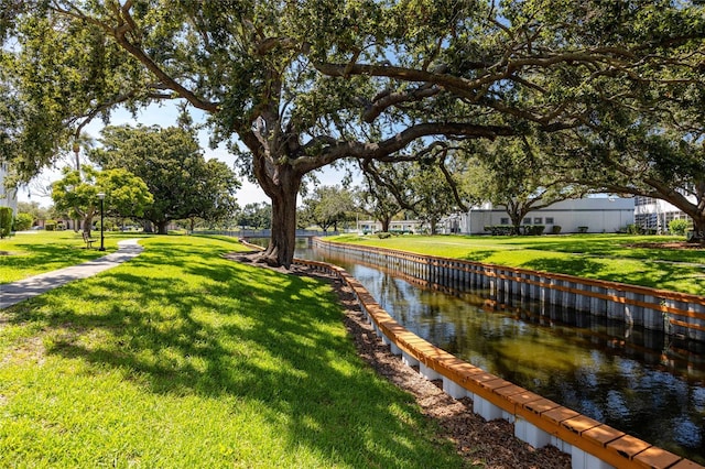 8584 111th St Unit 308, Seminole, FL 33772 - view of green lawn featuring a water view