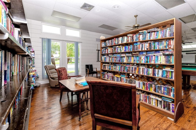 8584 111th St Unit 308, Seminole, FL 33772 - living area with hardwood / wood-style floors, ceiling fan, and a drop ceiling