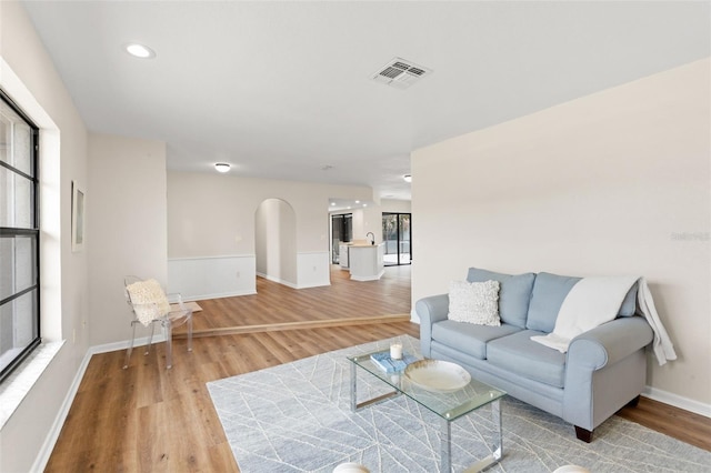 4530 Zack Dr, New Port Richey, FL 34653 - living room with wood finished floors, arched walkways, and recessed lighting