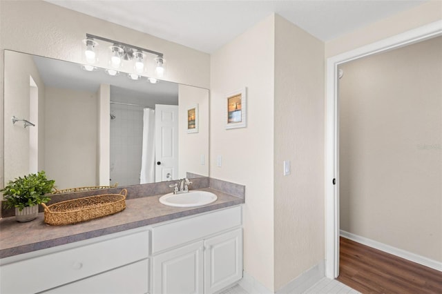 4530 Zack Dr, New Port Richey, FL 34653 - full bathroom with vanity, a shower, and wood finished floors