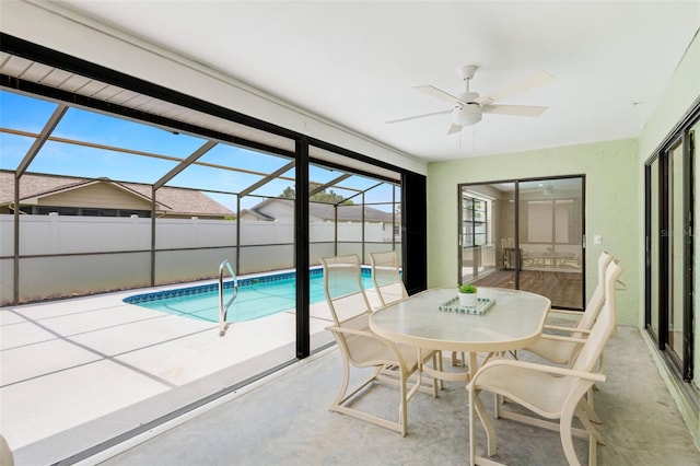 4530 Zack Dr, New Port Richey, FL 34653 - sunroom featuring a swimming pool, a ceiling fan, and outdoor dining area