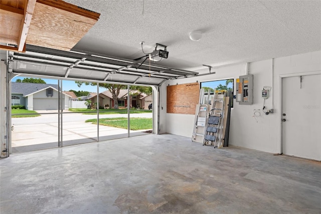 4530 Zack Dr, New Port Richey, FL 34653 - garage featuring electric panel and a garage door opener