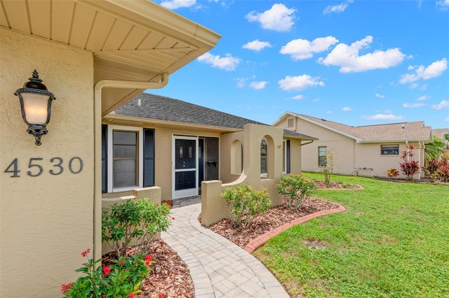 4530 Zack Dr, New Port Richey, FL 34653 - exterior space featuring stucco siding and a yard