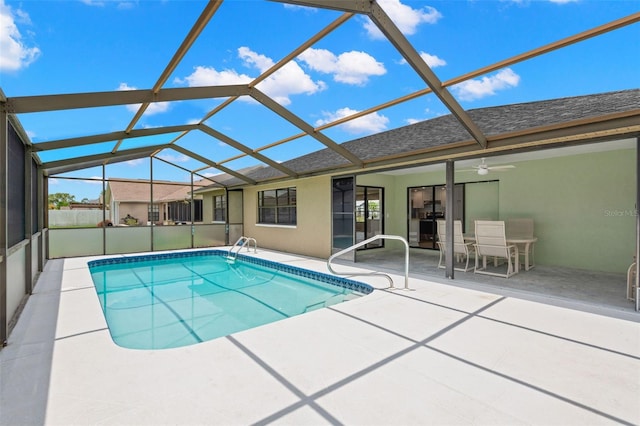 4530 Zack Dr, New Port Richey, FL 34653 - outdoor pool with a patio, glass enclosure, and a ceiling fan