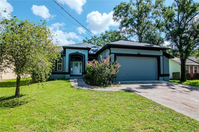 211 Arlington Ave E, Oldsmar, FL 34677 - view of front facade with stucco siding, a garage, a front lawn, and driveway