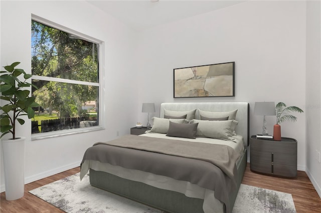 211 Arlington Ave E, Oldsmar, FL 34677 - bedroom with wood finished floors and baseboards