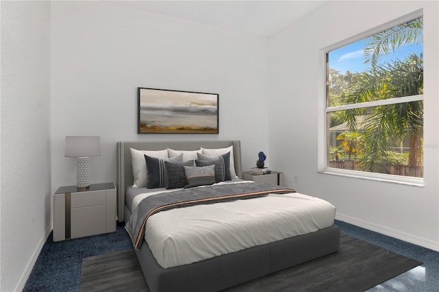 211 Arlington Ave E, Oldsmar, FL 34677 - bedroom featuring baseboards and dark carpet