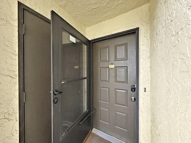 700 Starkey Rd Unit 311, Largo, FL 33771 - property entrance featuring stucco siding