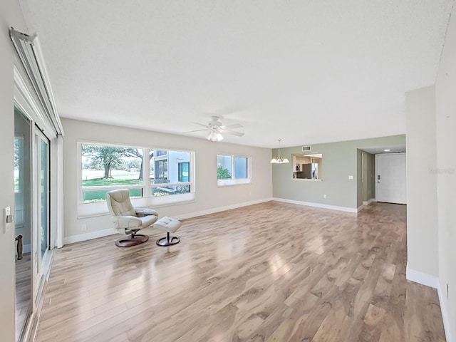 700 Starkey Rd Unit 311, Largo, FL 33771 - unfurnished living room with light wood finished floors and ceiling fan