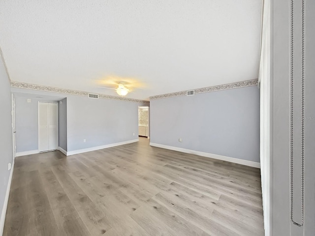 700 Starkey Rd Unit 311, Largo, FL 33771 - empty room with wood finished floors and ceiling fan