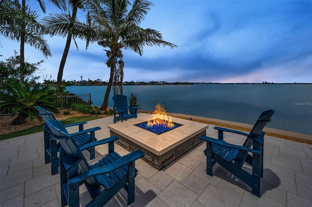 4381 Poinsettia Dr, St Pete Beach, FL 33706 - view of patio featuring an outdoor fire pit and a water view